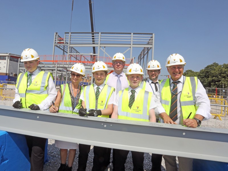 New Mosslands School celebrates milestone with steel signing ceremony 